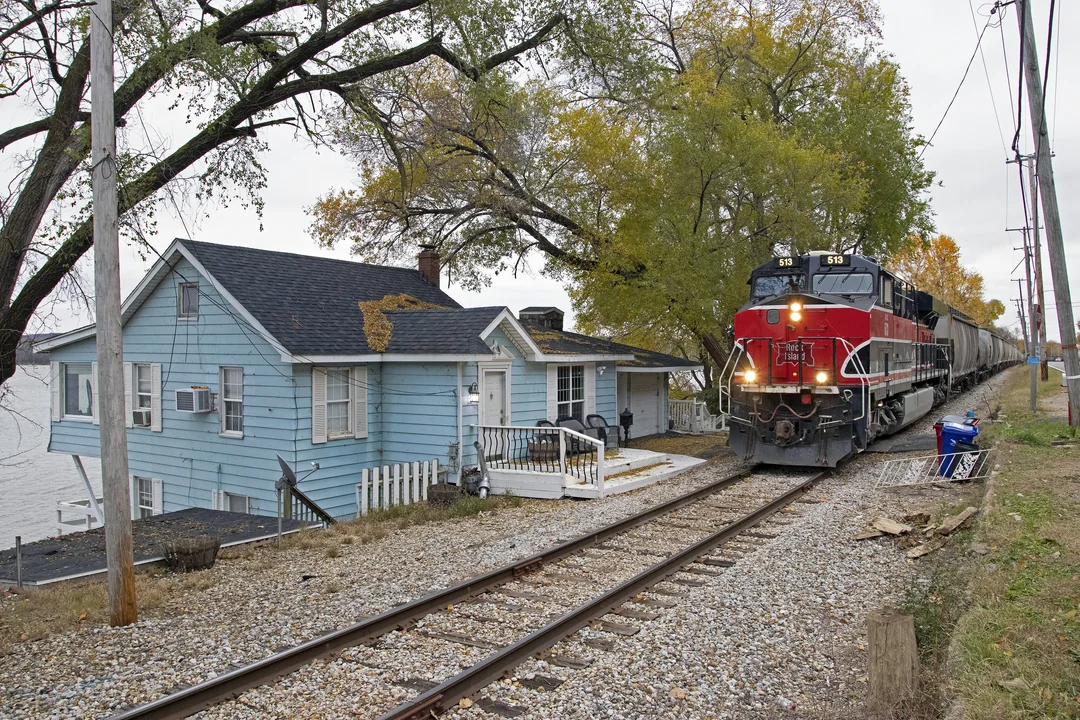 A house sitting directly beside active railroad tracks
